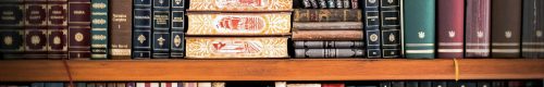 pexels-photo-207662-207662 A detailed view of a bookshelf with vintage and classic books arranged neatly, offering a historic ambiance.